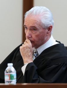 Judge Thomas Horgan listens to testimony during a dangerousness hearing for James Stumbo and Kevin Norton at Boston Municipal Court, Tuesday, Sept. 1, 2015.  Norton and Stumbo, of Iowa, accused of making online threats of violence against the World Pokémon Championships competition in Boston, were ordered held without bail Tuesday after Judge Horgan rejected arguments by their lawyers that their comments amounted to idle online bravado. (Angela Rowlings/The Boston Herald via AP, Pool)