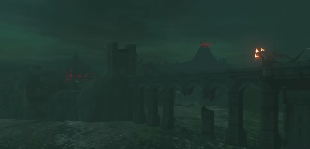 Il ponte di Hylia con sopra di esso un drago con delle fiamme sulla testa, e dietro il castello di Hyrule e il vulcano. Tratto dal trailer di Zelda Tears of the Kingdom.